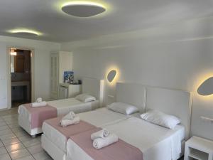 Cama ou camas em um quarto em Paolas Sunset