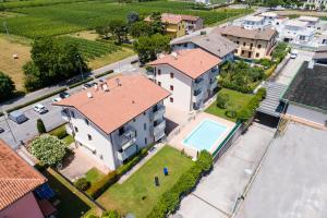 an aerial view of a house with a swimming pool at Wolf House - Sirmione Holiday in Sirmione