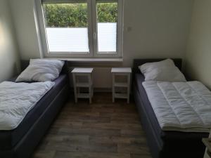 Postel nebo postele na pokoji v ubytování Ferienhaus Frank Saathoff