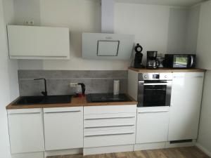 Kuchyň nebo kuchyňský kout v ubytování Ferienhaus Frank Saathoff