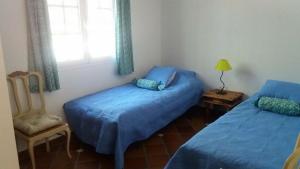Postel nebo postele na pokoji v ubytování Casa los Almendros