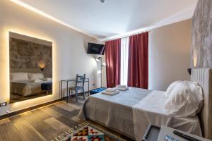 a hotel room with a bed and a window at Sant'Alfonso in Agrigento