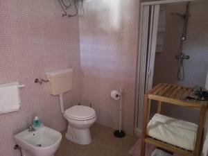 a bathroom with a white toilet and a sink at B&B Angolo Magico in Baia Di Gallipoli +34 photos