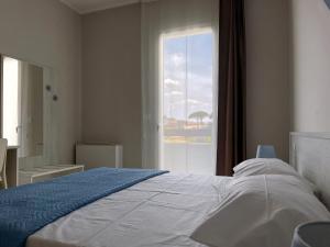 Postel nebo postele na pokoji v ubytování Karpignàna Hotel