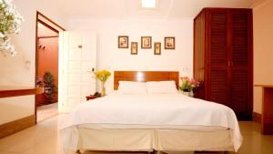
A bed or beds in a room at Pousada El Parador
