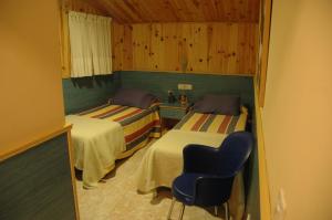 Postel nebo postele na pokoji v ubytování Hostal El Cartero