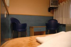 Postel nebo postele na pokoji v ubytování Hostal El Cartero
