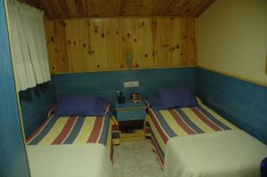 Postel nebo postele na pokoji v ubytování Hostal El Cartero