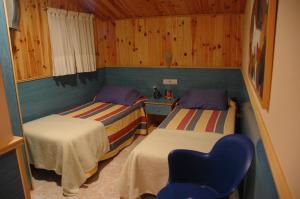 Postel nebo postele na pokoji v ubytování Hostal El Cartero