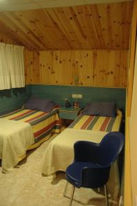 Postel nebo postele na pokoji v ubytování Hostal El Cartero