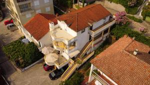 an overhead view of a large house with red roofs at Villa Vojnic in Budva