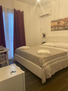 Postel nebo postele na pokoji v ubytování B&B Libertà
