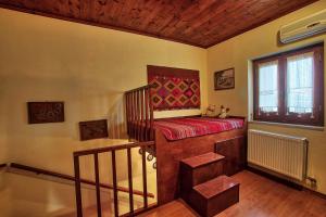 A bed or beds in a room at Cretan Traditional Home