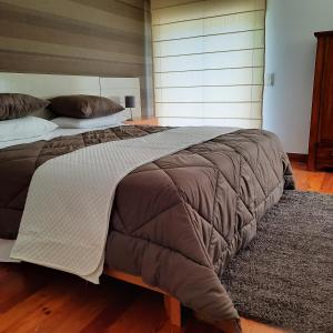 Tempat tidur dalam kamar di Casa da Escola