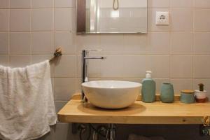 a bathroom with a bowl sink on a counter at Gosto do Campo in Lavre +15 photos