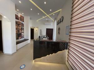 a lobby with a reception desk in a building at Petra Heart Hotel in Wadi Musa