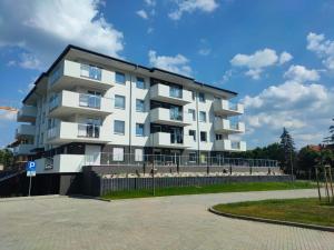 a large white apartment building on a beach at Haven Apart 2 in Jelenia Góra