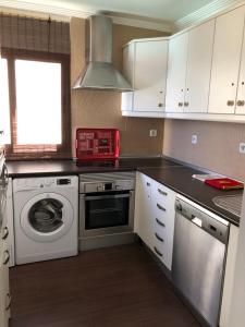 A kitchen or kitchenette at Panoramic Ocean View Apartment