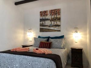 A bed or beds in a room at Panoramic Ocean View Apartment