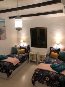 A bed or beds in a room at Panoramic Ocean View Apartment