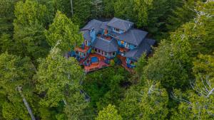 an aerial view of a large house in the woods at Snug Harbour Inn in Ucluelet