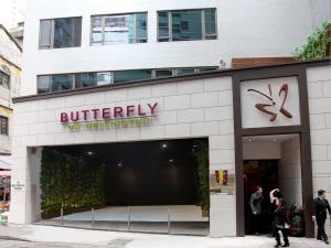 a store front of a building with people walking outside at Butterfly on Wellington, Central in Hong Kong