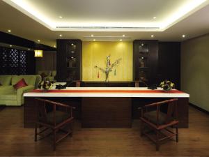 a large living room with a tub and two chairs at Butterfly on Wellington, Central in Hong Kong