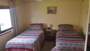 Ein Bett oder Betten in einem Zimmer der Unterkunft Ema B and B