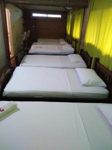 En eller flere senge i et værelse på CasaHotelMarly