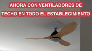 a wooden ceiling fan with a sign that reads aloracon ventilators de at Apartamentos Eldorado in Lloret de Mar