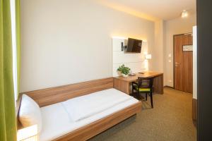 Voodi või voodid majutusasutuse JOESEPP´S HOTEL am Hallhof toas