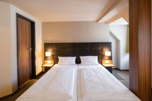 Voodi või voodid majutusasutuse JOESEPP´S HOTEL am Hallhof toas