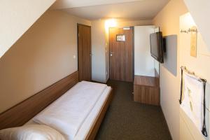 Voodi või voodid majutusasutuse JOESEPP´S HOTEL am Hallhof toas