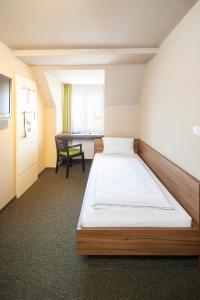 Voodi või voodid majutusasutuse JOESEPP´S HOTEL am Hallhof toas
