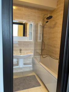a bathroom with a sink and a shower at Perfect Spot Summerland Mamaia in Mamaia