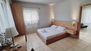 Postel nebo postele na pokoji v ubytování Chloe Apartments