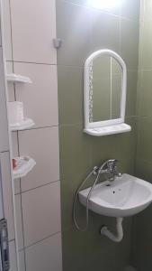 a bathroom with a sink and a mirror at На гости при Силвия in Obzor +66 photos