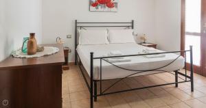 A bed or beds in a room at Domo Galante