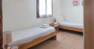 A bed or beds in a room at Domo Galante