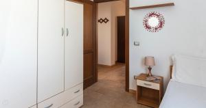 A bed or beds in a room at Domo Galante
