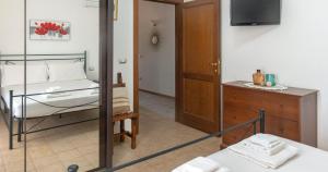 A bed or beds in a room at Domo Galante