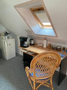 a room with a wooden desk with a skylight at Ebeltoft Centrum in Ebeltoft