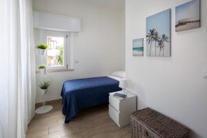 Posteľ alebo postele v izbe v ubytovaní Appartamenti Villa Miramare