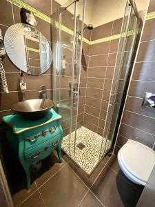 a bathroom with a sink and a shower at Hotel le Romanesque in Cannes +27 photos