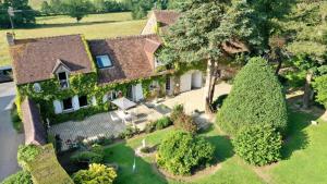 an aerial view of a large house with trees at 7 , le Haut Montrayé in Pacé