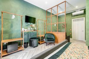 A television and/or entertainment centre at Ripetta Natural Suites