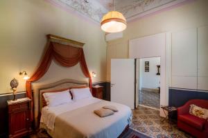 Giường trong phòng chung tại Palazzo Rollo