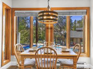 a dining room with a table and chairs and a window at Inner Circle 3 Condo in Breckenridge
