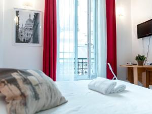 Ein Bett oder Betten in einem Zimmer der Unterkunft Montmartre Apartments Dalida