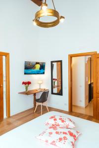 A bed or beds in a room at Relais CuoreNapoletano